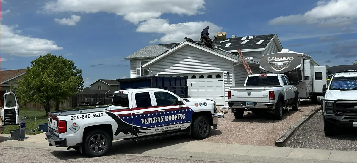 Veteran Roofing workers on a roof